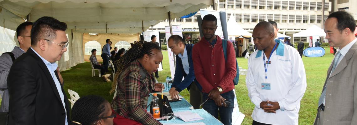Director of Office of Career Services Mr. Kinyua takes through guests to the stand