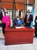 Prof George Magoha CS Education Kenya signing visitors book